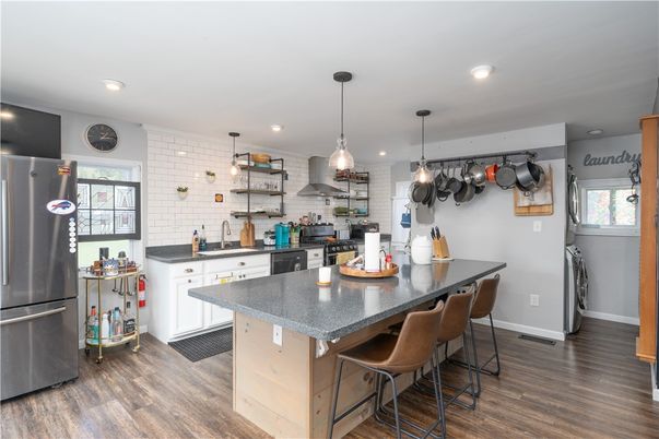 Interior, Kitchen, Pendant Lights, Recessed Lighting, Stainless Steel Appliances, Stone Walls, Wood Texture Flooring