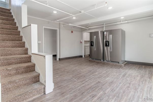 Elevator, Interior, Kitchen, Recessed Lighting, Stainless Steel Appliances, Wood Texture Flooring