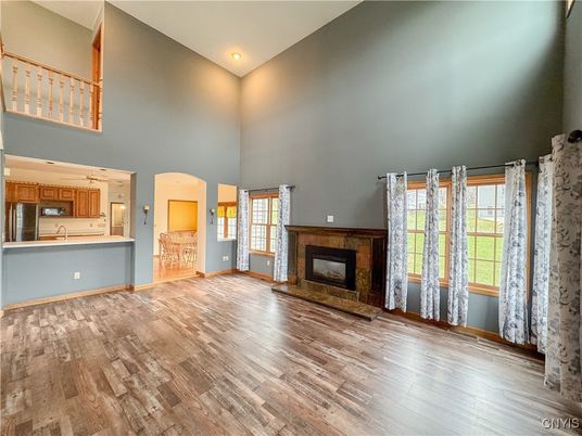 Empty room, Fireplace, Interior, Kitchen, Recessed Lighting, Wood Texture Flooring