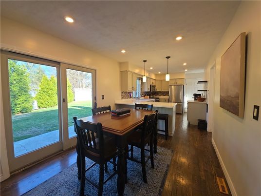 Dining room, Interior, Kitchen, Pendant Lights, Recessed Lighting, Stainless Steel Appliances, Wood Texture Flooring