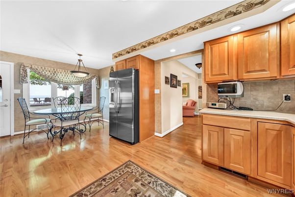 Dining room, Interior, Kitchen, Pendant Lights, Recessed Lighting, Stainless Steel Appliances, Wood Texture Flooring