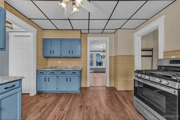 Chandelier, Interior, Kitchen, Stainless Steel Appliances, Stone Walls, Wood Texture Flooring