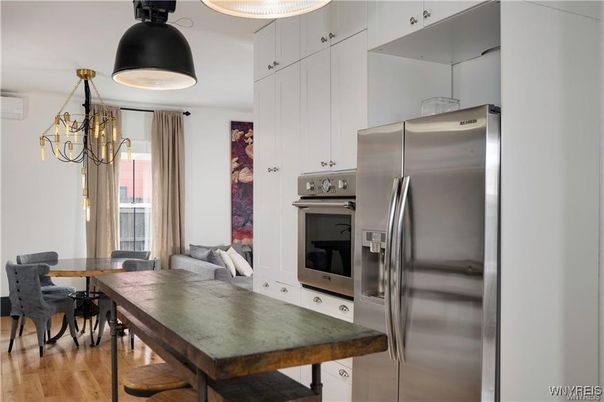 Chandelier, Dining room, Interior, Kitchen, Stainless Steel Appliances, Wood Texture Flooring