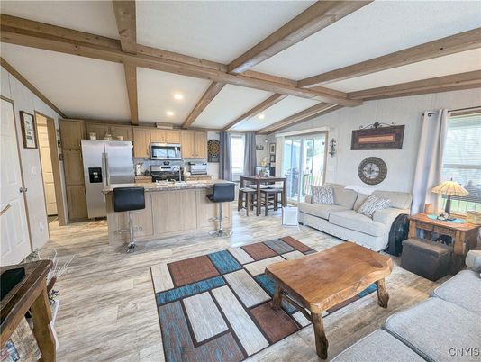 Dining room, Interior, Kitchen, Living room, Recessed Lighting, Stainless Steel Appliances, Wooden Beams, Wood Texture Flooring