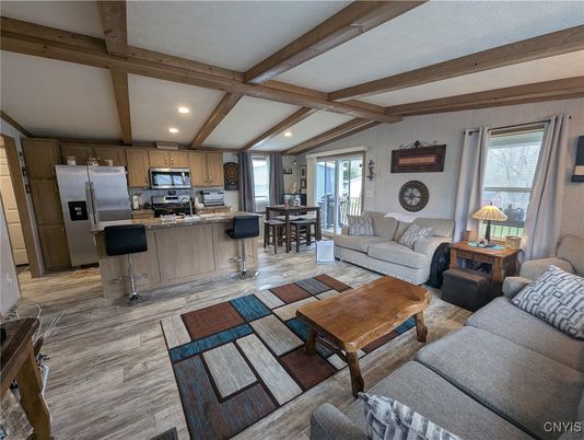 Dining room, Interior, Kitchen, Living room, Recessed Lighting, Stainless Steel Appliances, Wooden Beams, Wood Texture Flooring