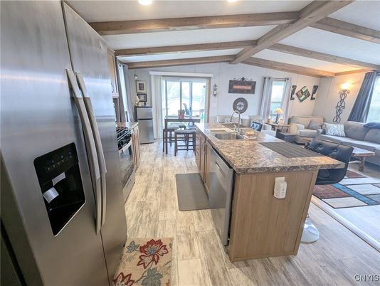 Dining room, Interior, Kitchen, Living room, Recessed Lighting, Stainless Steel Appliances, Wooden Beams, Wood Texture Flooring