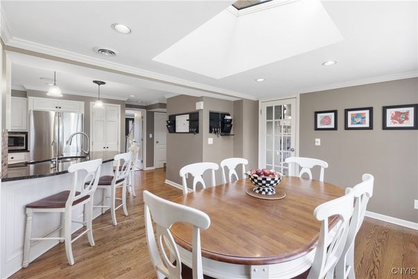 Dining room, Interior, Kitchen, Pendant Lights, Recessed Lighting, Stainless Steel Appliances, Wood Texture Flooring