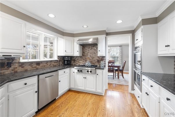 Dining room, Interior, Kitchen, Recessed Lighting, Stainless Steel Appliances, Wood Texture Flooring
