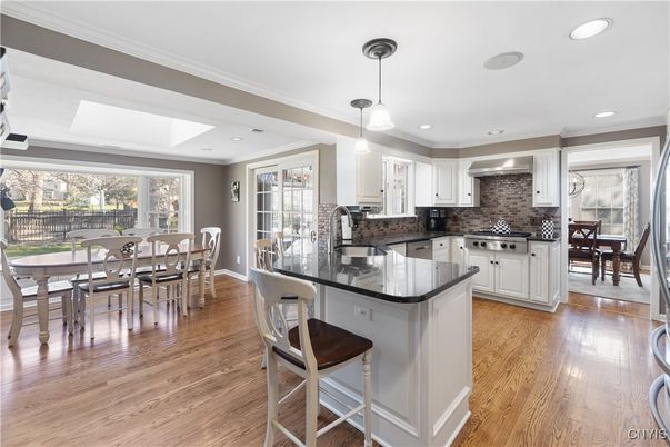 Dining room, Interior, Kitchen, Pendant Lights, Recessed Lighting, Stainless Steel Appliances, Wood Texture Flooring