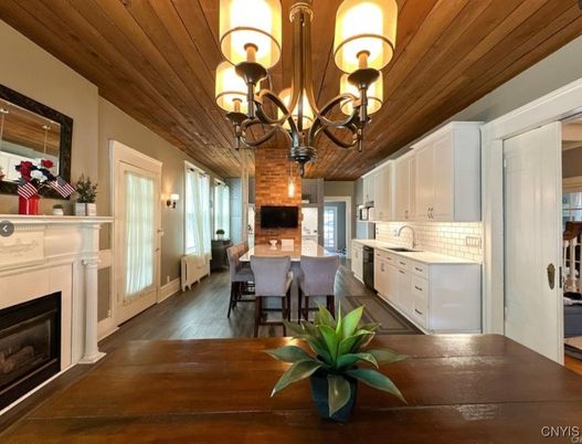 Chandelier, Dining room, Fireplace, Interior, Kitchen, Wooden Ceilings, Wood Texture Flooring