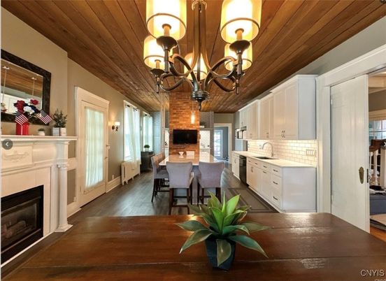 Chandelier, Dining room, Fireplace, Interior, Kitchen, Wooden Ceilings, Wood Texture Flooring