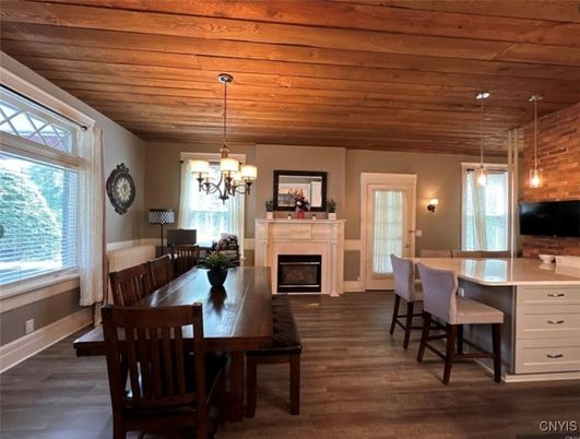 Chandelier, Dining room, Fireplace, Interior, Pendant Lights, Wooden Ceilings, Wood Texture Flooring