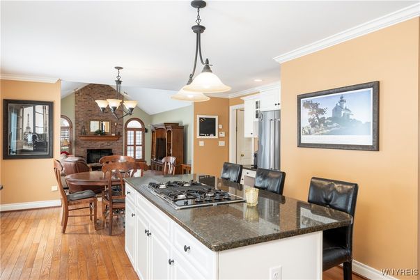 Chandelier, Dining room, Fireplace, Interior, Kitchen, Pendant Lights, Recessed Lighting, Stone Walls, Wood Texture Flooring