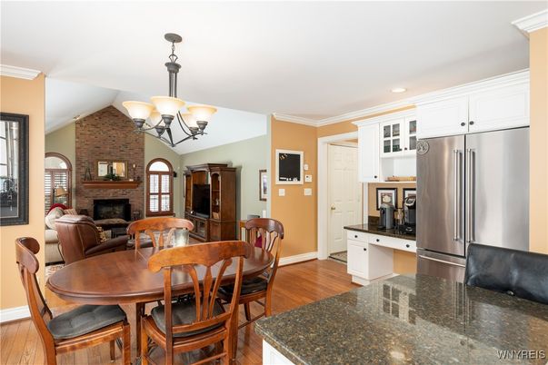 Chandelier, Dining room, Fireplace, Interior, Kitchen, Recessed Lighting, Stone Walls, Wood Texture Flooring