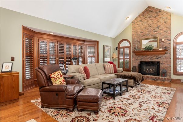 Fireplace, Interior, Living room, Recessed Lighting, Stone Walls, Wood Texture Flooring
