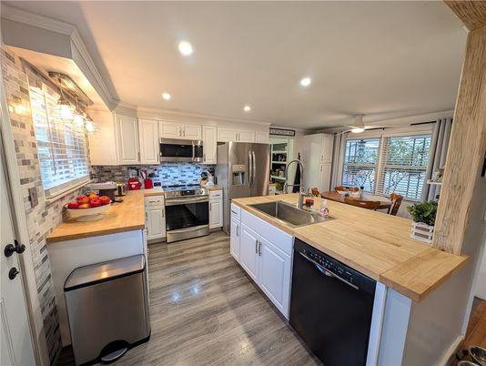 Dining room, Interior, Kitchen, Recessed Lighting, Stainless Steel Appliances, Wood Texture Flooring