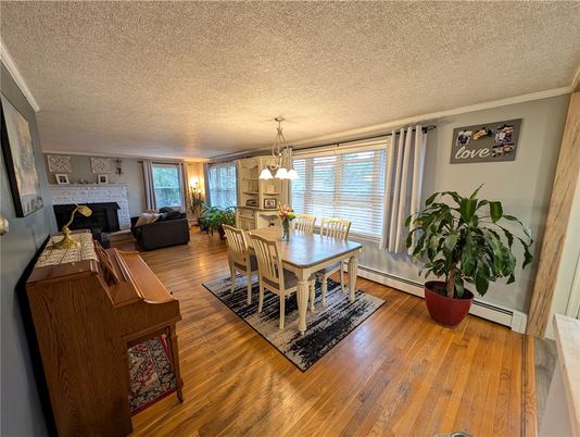 Dining room, Fireplace, Interior, Living room, Pendant Lights, Wood Texture Flooring