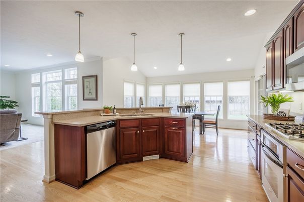 Dining room, Interior, Kitchen, Pendant Lights, Recessed Lighting, Stainless Steel Appliances, Wood Texture Flooring