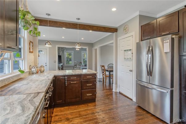 Dining room, Interior, Kitchen, Pendant Lights, Recessed Lighting, Stainless Steel Appliances, Wood Texture Flooring