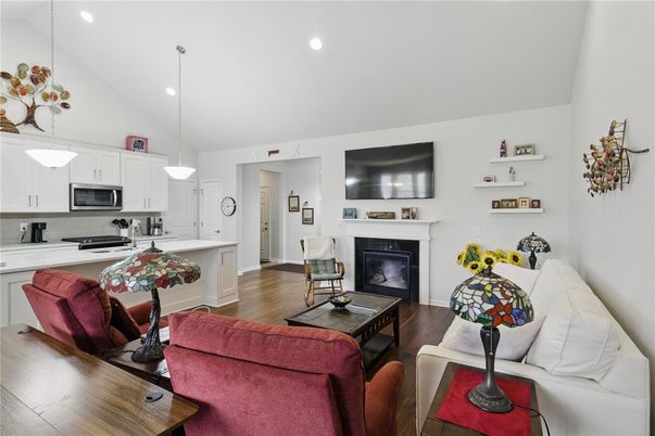 Fireplace, Interior, Kitchen, Living room, Pendant Lights, Recessed Lighting, Stainless Steel Appliances, Wood Texture Flooring