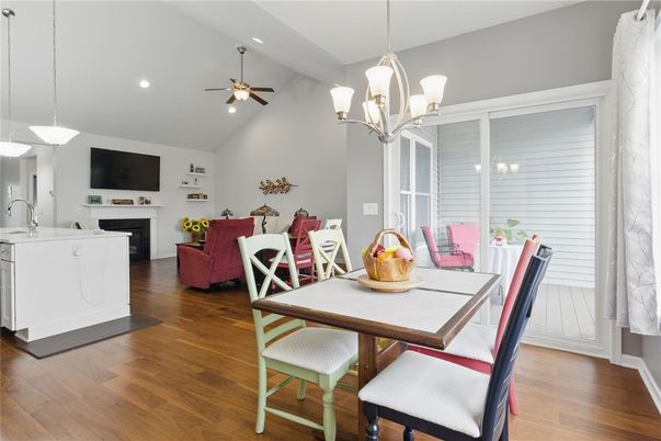 Chandelier, Dining room, Fireplace, Interior, Living room, Pendant Lights, Recessed Lighting, Wood Texture Flooring
