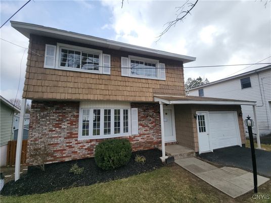 Attached, Exterior, Facade, Brick Facade, American Foursquare