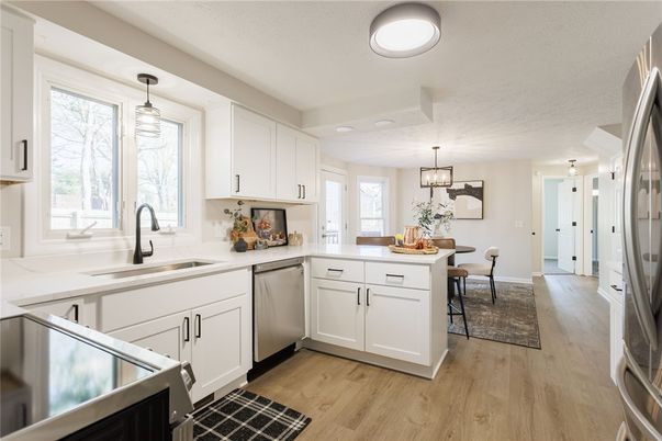 Chandelier, Dining room, Interior, Kitchen, Pendant Lights, Stainless Steel Appliances, Wood Texture Flooring