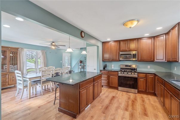 Dining room, Interior, Kitchen, Pendant Lights, Recessed Lighting, Stainless Steel Appliances, Wood Texture Flooring