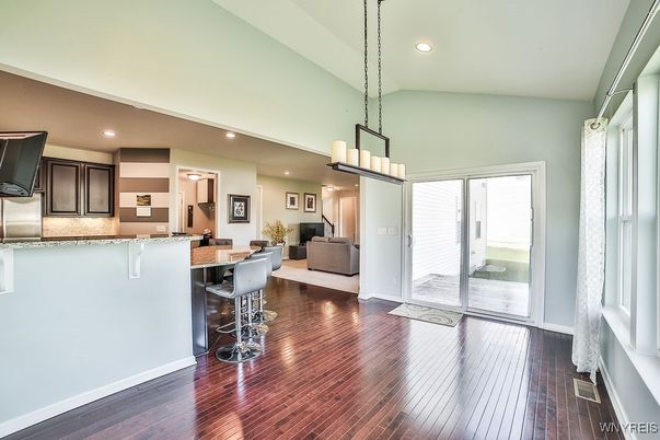 Chandelier, Interior, Kitchen, Living room, Pendant Lights, Recessed Lighting, Stainless Steel Appliances, Wood Texture Flooring