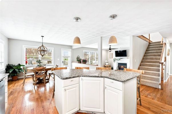 Dining room, Fireplace, Interior, Pendant Lights, Wood Texture Flooring