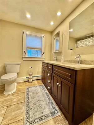 Bathroom, Dual Sink Vanities, Interior, Recessed Lighting, Wood Texture Flooring