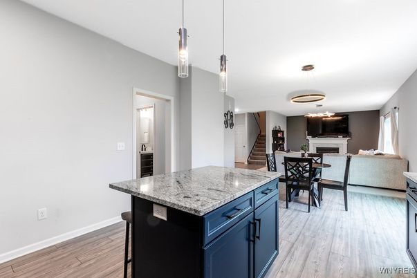 Dining room, Fireplace, Interior, Pendant Lights, Wood Texture Flooring