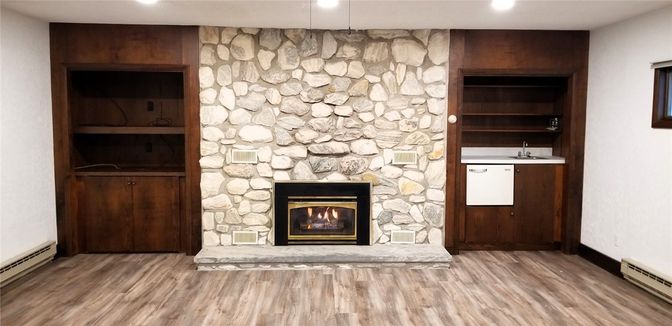 Fireplace, Interior, Recessed Lighting, Stone Walls, Wood Texture Flooring