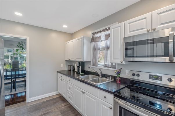 Dining room, Interior, Kitchen, Recessed Lighting, Stainless Steel Appliances, Wood Texture Flooring