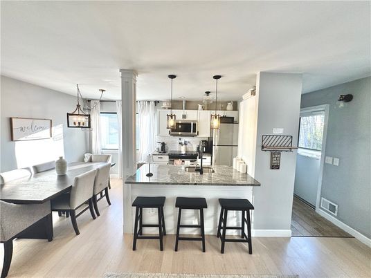 Dining room, Interior, Kitchen, Pendant Lights, Stainless Steel Appliances, Wood Texture Flooring