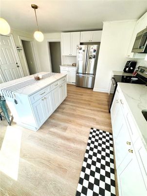 Interior, Kitchen, Pendant Lights, Tile Countertops, Wood Texture Flooring
