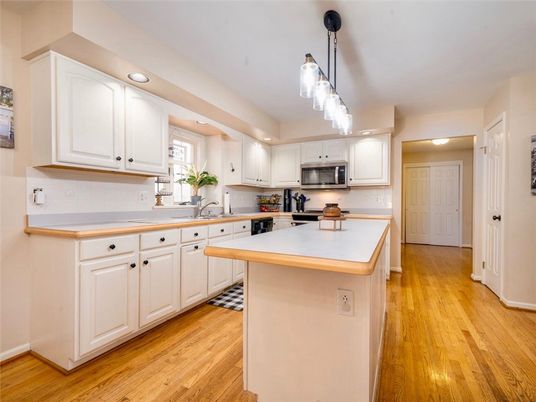Interior, Kitchen, Pendant Lights, Recessed Lighting, Stainless Steel Appliances, Wood Texture Flooring