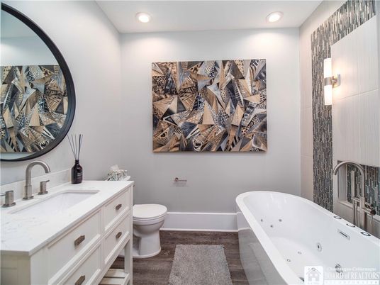 Bathroom, Dual Sink Vanities, Free Standing Baths, Interior, Recessed Lighting, Wood Texture Flooring