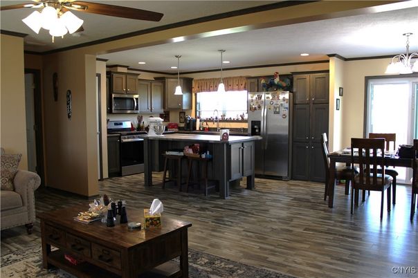 Dining room, Interior, Kitchen, Pendant Lights, Recessed Lighting, Stainless Steel Appliances, Wood Texture Flooring