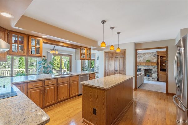 Fireplace, Interior, Kitchen, Pendant Lights, Recessed Lighting, Stainless Steel Appliances, Wood Texture Flooring