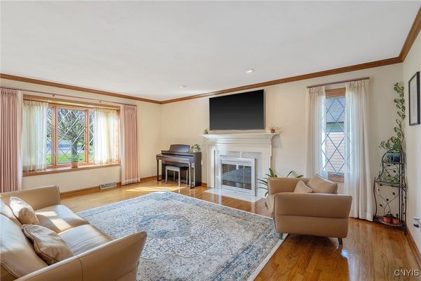 Fireplace, Interior, Living room, Piano, Recessed Lighting, Wood Texture Flooring