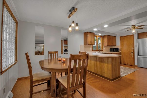 Dining room, Interior, Kitchen, Pendant Lights, Recessed Lighting, Stainless Steel Appliances, Wood Texture Flooring