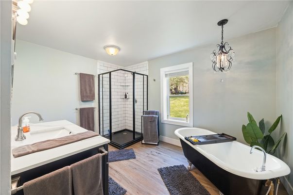 Bathroom, Chandelier, Free Standing Baths, Glass Shower, Interior, Pendant Lights, Wood Texture Flooring