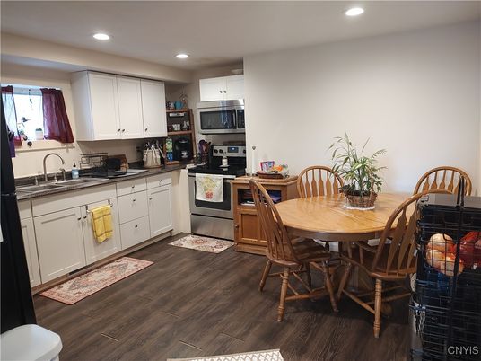 Dining room, Interior, Kitchen, Recessed Lighting, Stainless Steel Appliances, Wood Texture Flooring