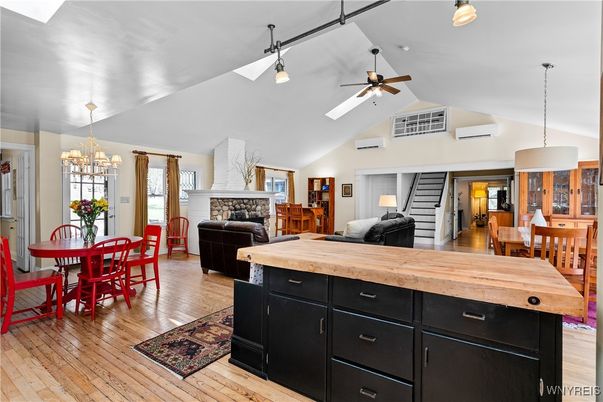 Dining room, Fireplace, Interior, Living room, Pendant Lights, Wood Texture Flooring