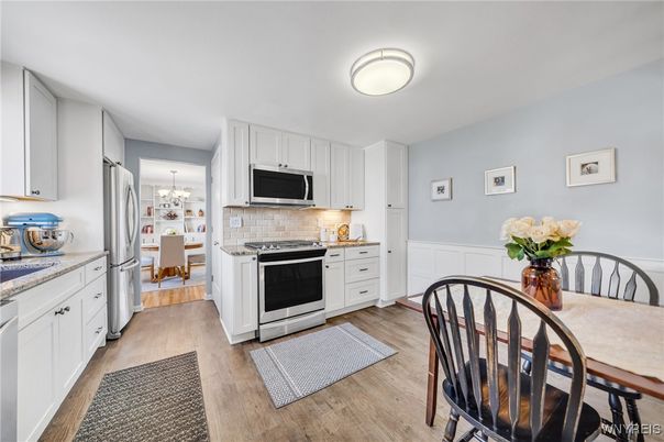 Chandelier, Dining room, Interior, Kitchen, Stainless Steel Appliances, Wood Texture Flooring