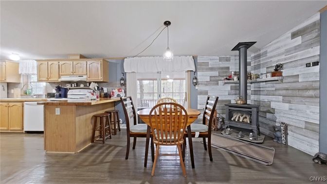 Dining room, Fireplace, Interior, Kitchen, Pendant Lights, Wood Texture Flooring, Wooden Walls