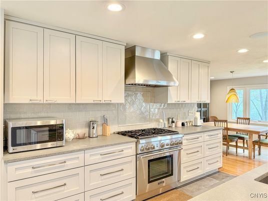 Dining room, Interior, Kitchen, Pendant Lights, Recessed Lighting, Stainless Steel Appliances, Wood Texture Flooring