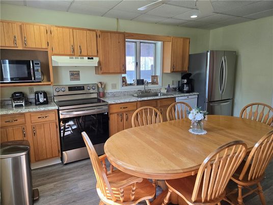 Dining room, Interior, Kitchen, Recessed Lighting, Stainless Steel Appliances, Water, Wood Texture Flooring