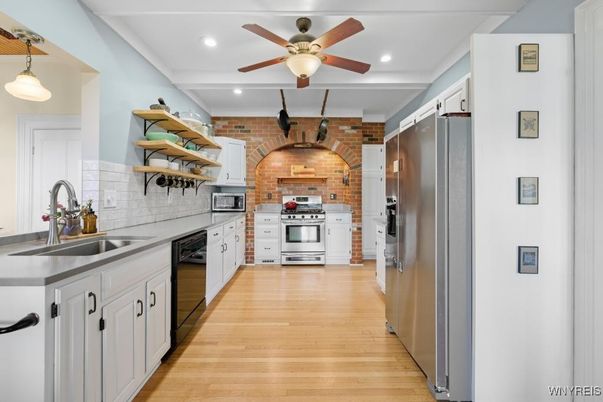 Interior, Kitchen, Pendant Lights, Recessed Lighting, Stainless Steel Appliances, Stone Walls, Wood Texture Flooring